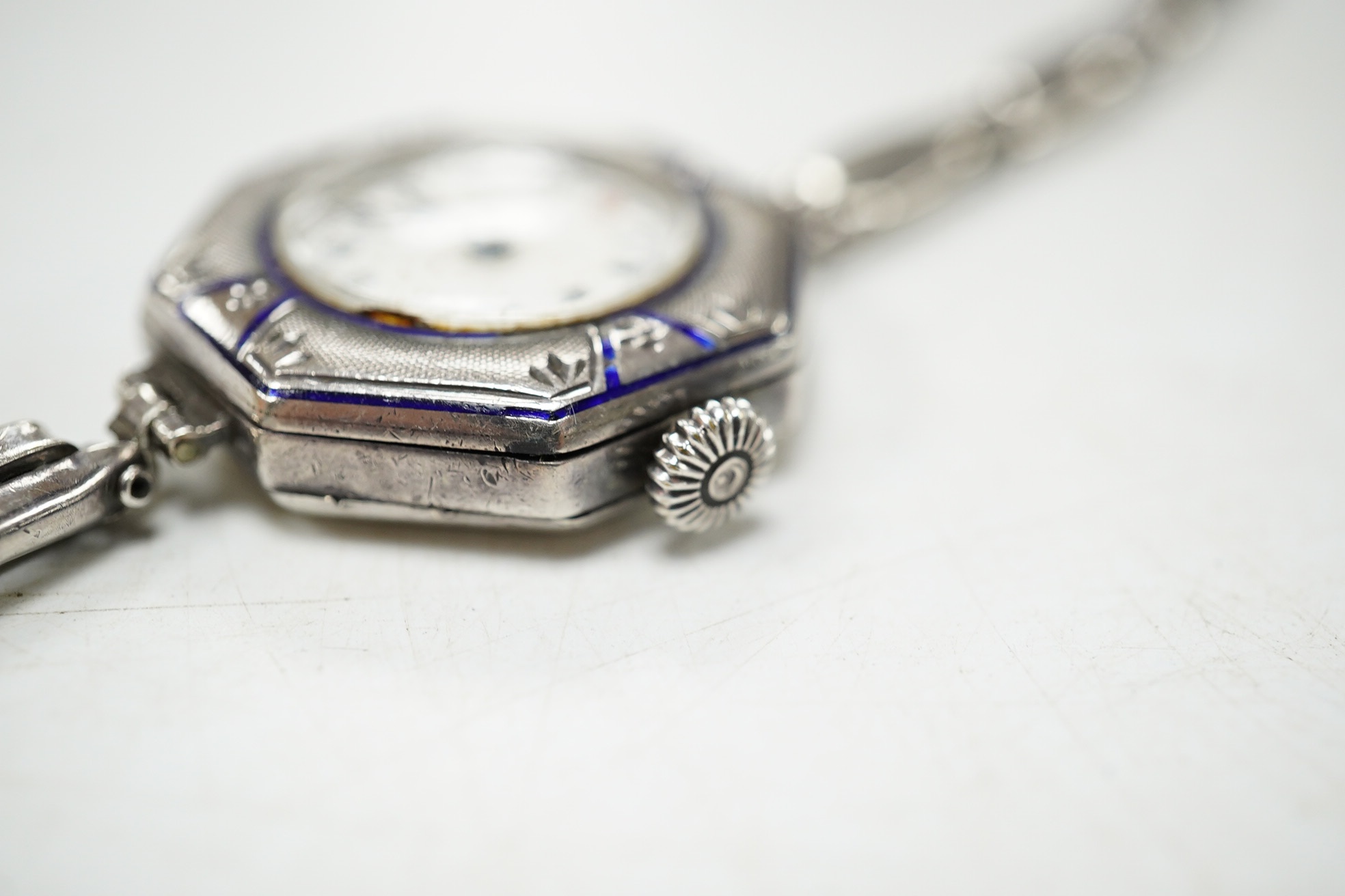 A lady's early 20th century continental sterling and enamel octagonal manual wind wrist watch, on a sterling expanding bracelet, 16.8cm. Condition - poor to fair